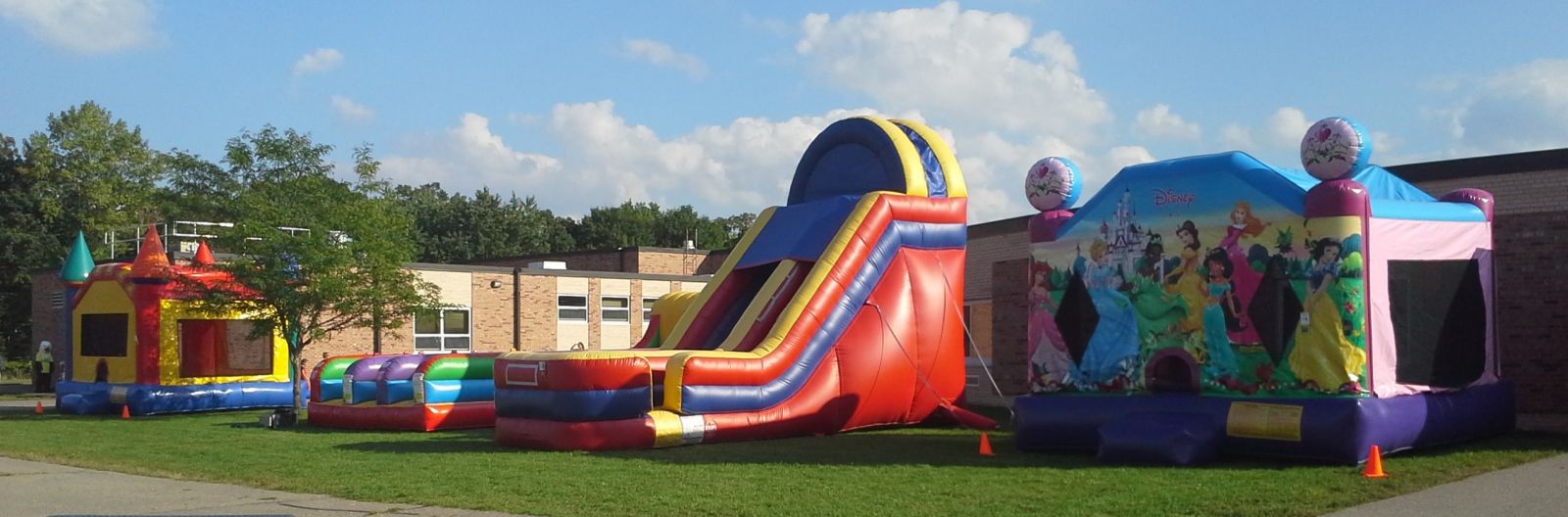 School carnival with Disney Princess Bounce House, GIANT Slide, Bungee Run, and Castle